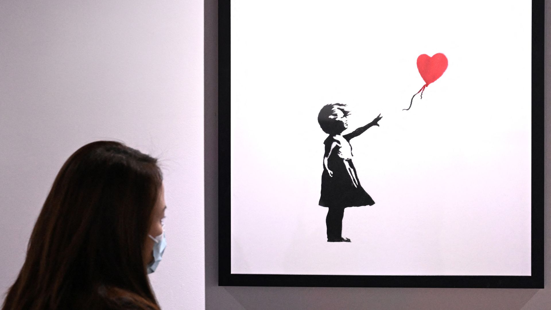 Banksy obra niña globo de corazón