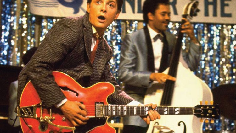 Michael J. Fox toca la guitarra en concierto de Coldplay Michael J. Fox toca la guitarra en concierto de Coldplay